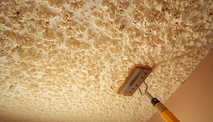 Popcorn ceiling texture in a room showing the bumpy stucco-like acoustical finish